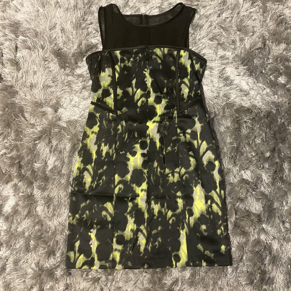 Never worn dress in a size small with mesh top.